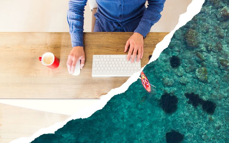 Guy working dreaming about nature vacations using torn paper effect.