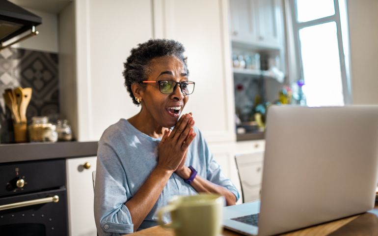 Close up of a senior woman using a laptop