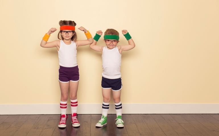 A boy and girl dressed as 80s nerds are ready to sweat to stay fit during this workout. Flex your biceps for ultimate self confidence.