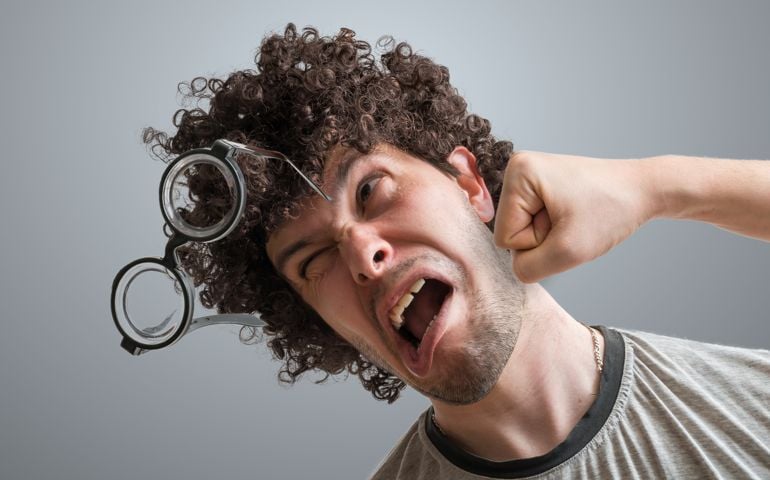 Funny man is getting punch in face with fist.