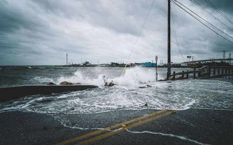 Water crashing over bridge during Hurricane Harvey in Kemah Texas
