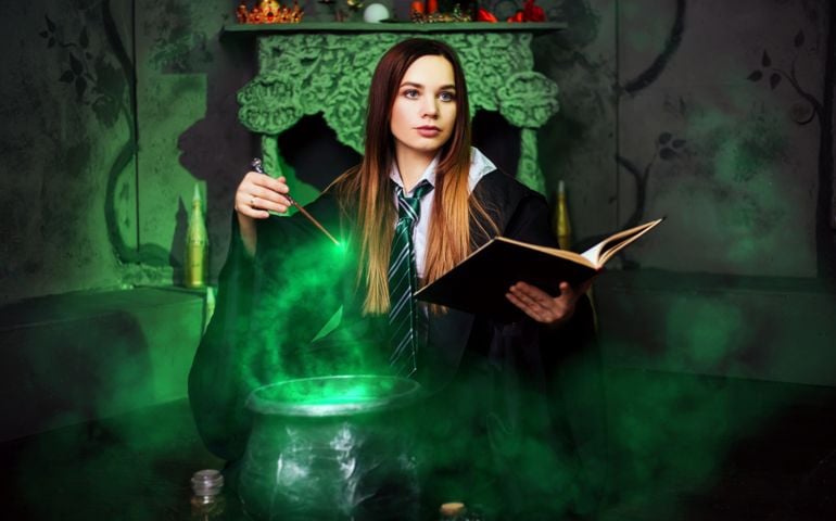 A young student of the magic school conjures.