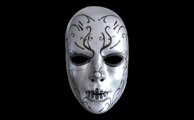 Creepy mask of death eater on the black background