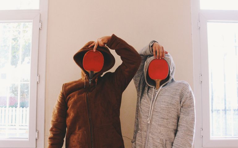 Two Funny People With Obscured Faces