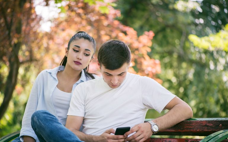 Young woman Spy on Boyfriend Cell Phone