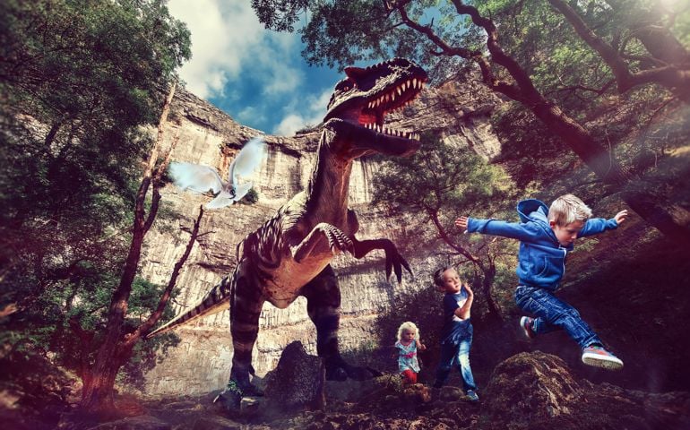 Composite image of t-rex dinosaur chasing children through forest