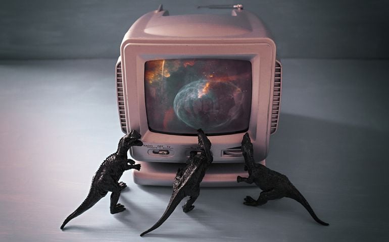 Three black dinosaurs touching vintage silver television over gray background. Searching for Life Beyond Earth.