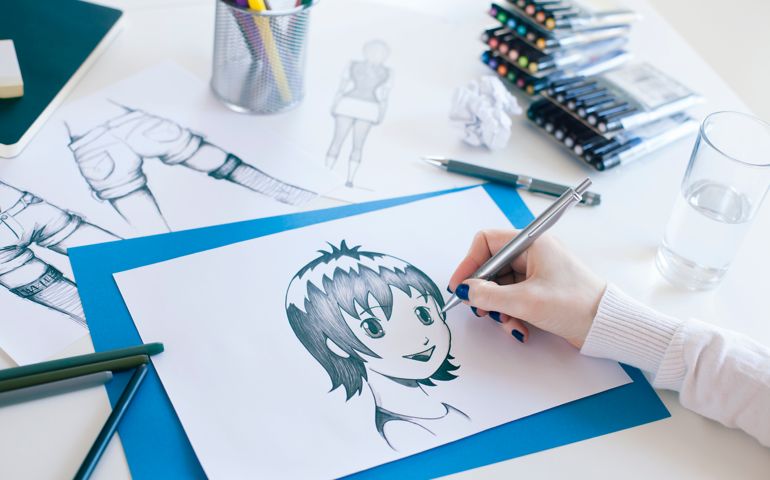Freelancer working at her home office. Manga style painter.