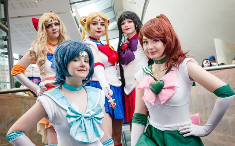 Cosplayers dressed as characters from the anime Sailor Moon at Manchester MCM Comic Convention.