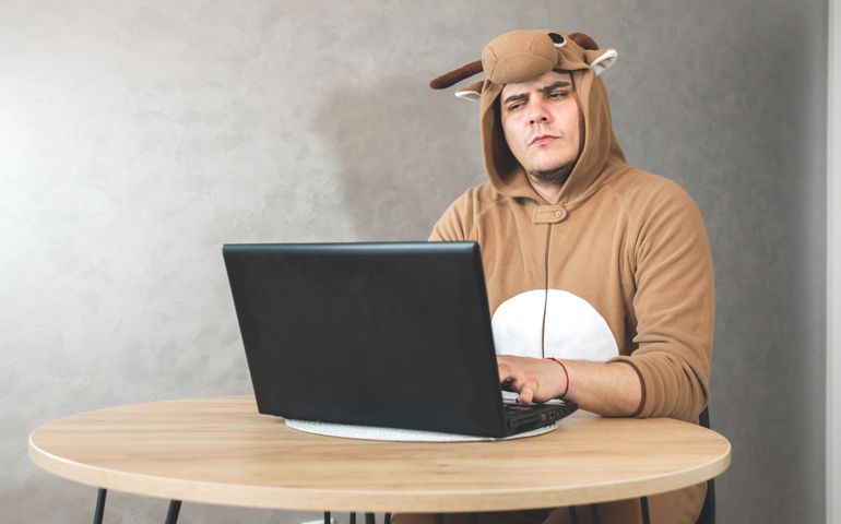 Office worker in cosplay costume of a cow