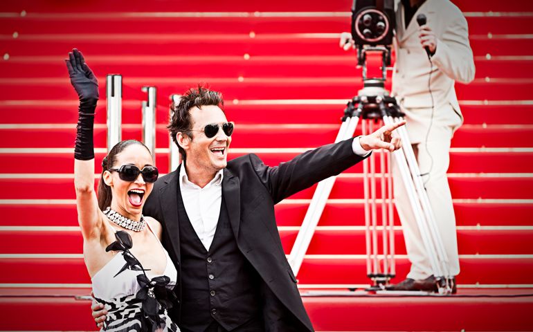 Celebrity couple on red carpet in Cannes. Taken on event iStockalypse Cannes 2010.