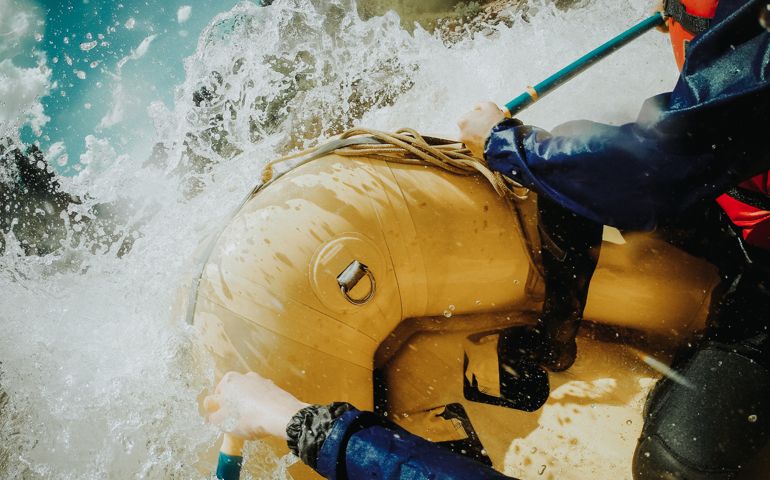 People Rafting In River