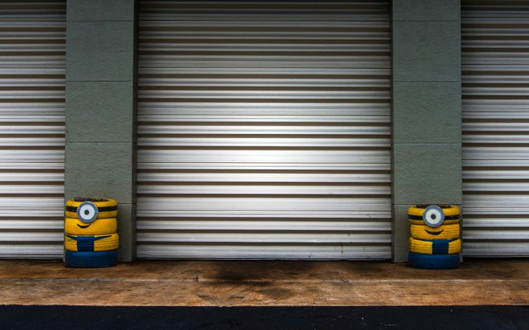 Despicable Me Minions Made Out of Car Tires And Painted For a Mechanic Shop
