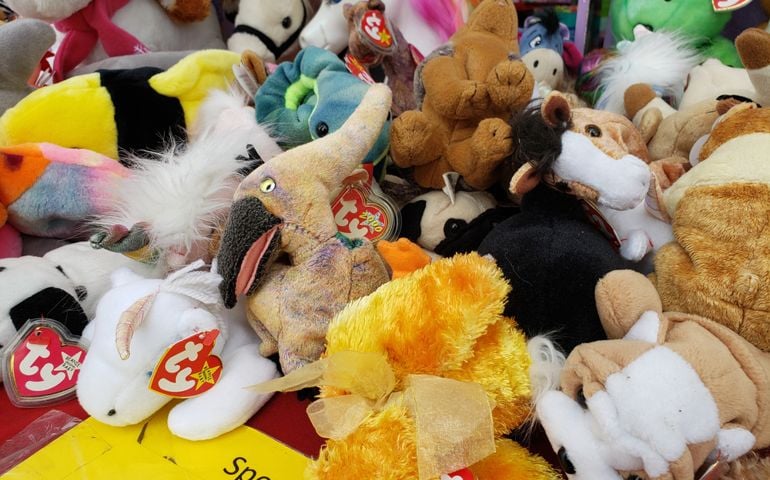 A view of a table full of vintage Beanie Babies stuffed animal toys, on display at a local swap meet.