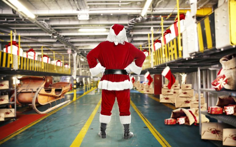 Santa claus and elf with gifts