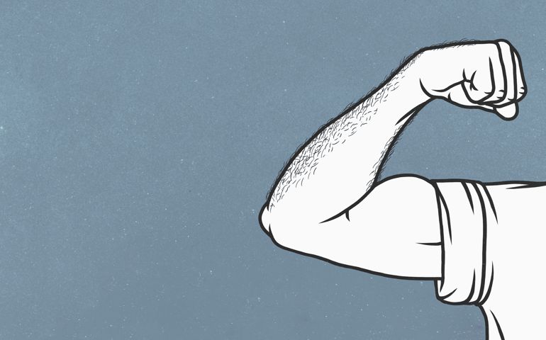 Man with hairy arms flexing biceps