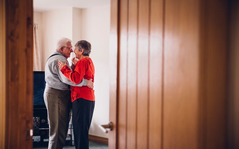 Senior couple dance in their Home.