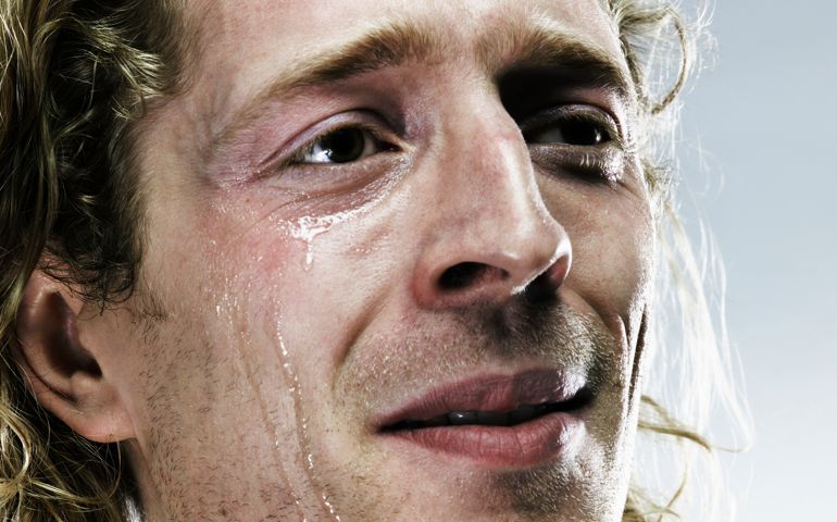 Young man crying, close-up