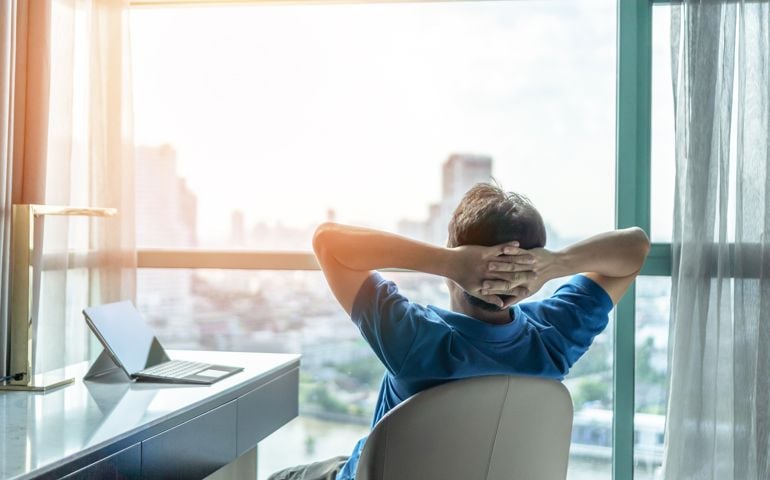 Life-work balance and city living lifestyle concept of business man relaxing