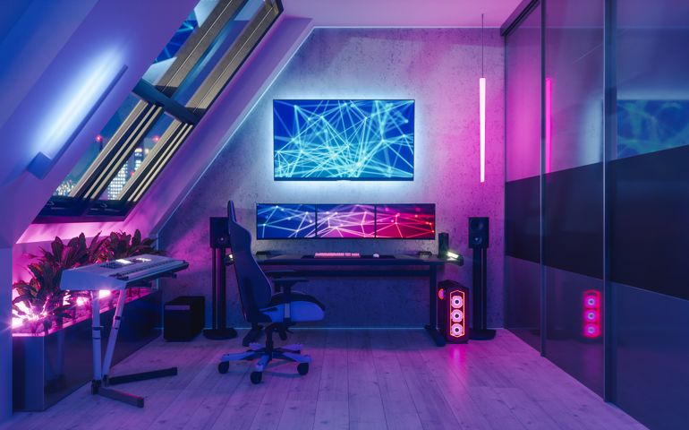 Interior of a gamer room lit with neon lights.