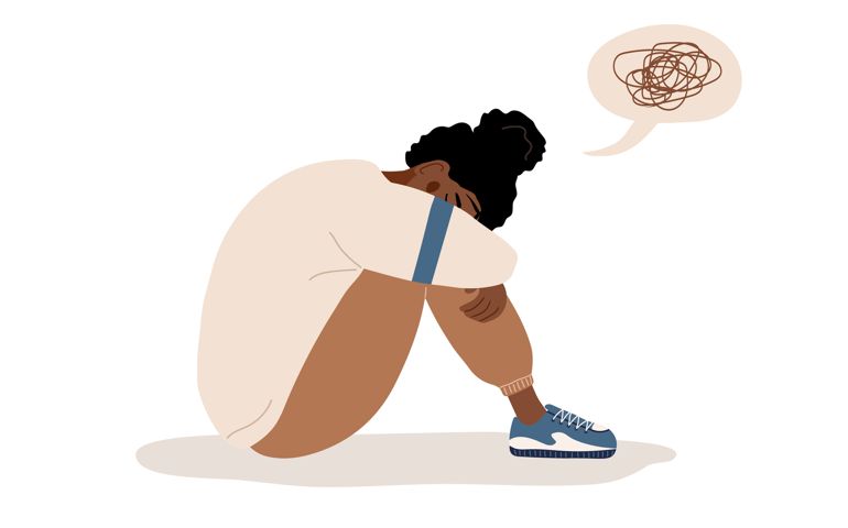 woman in depression. Sad teenager sitting on floor and crying.