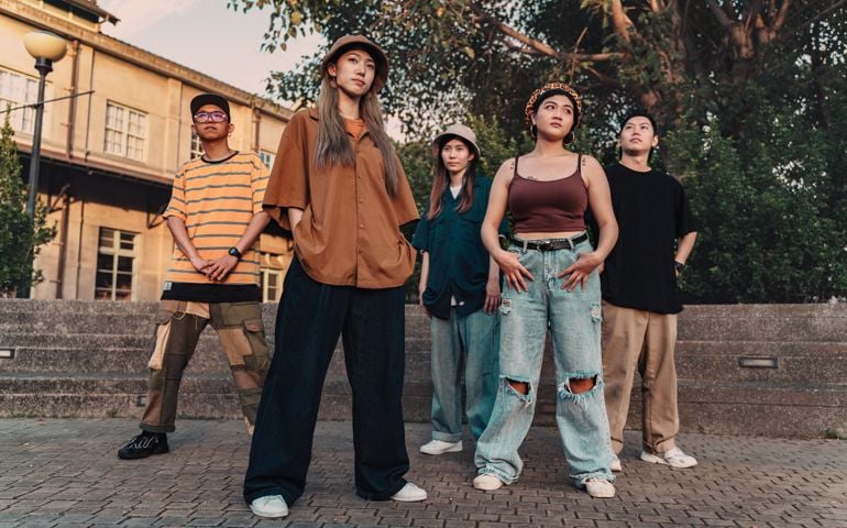 Group of hip hop dancers standing in an urban place