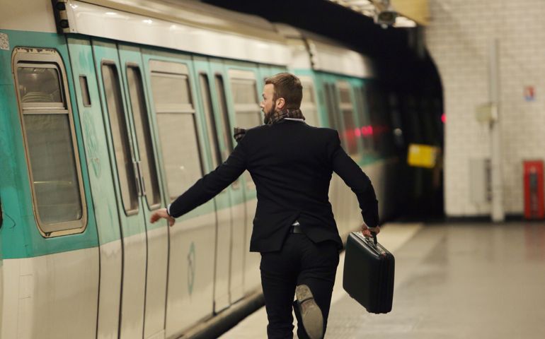 Man running for underground train
