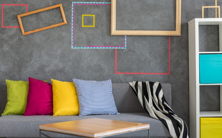 Room with modern tape wall decor, sofa and table