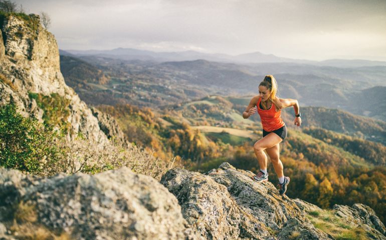 Young woman running on mountain