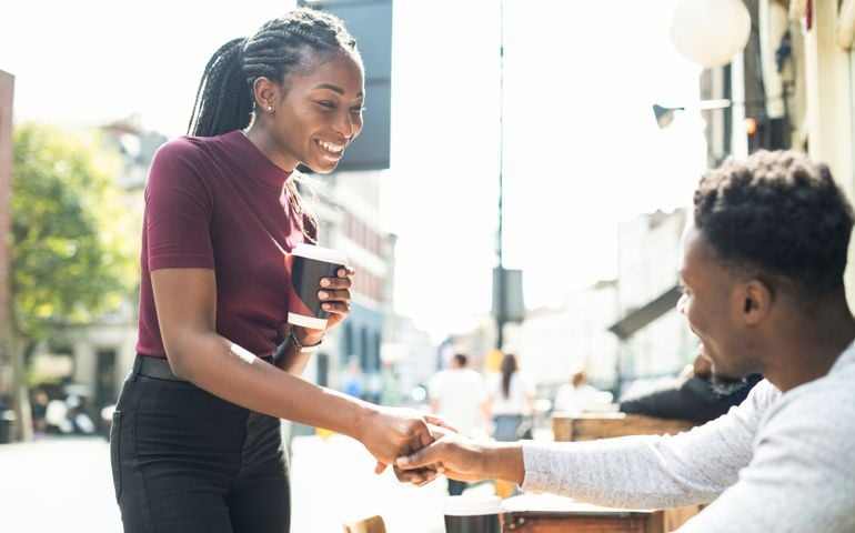 couple shaking hands together