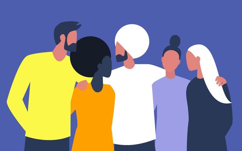 A diverse group of young people embracing each other, millennian friends