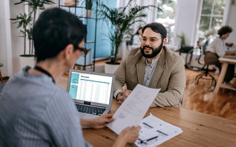 Confident businessman discussing with businesswoman
