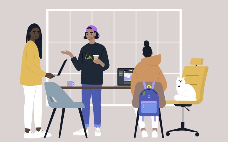 A diverse team of young adults working in the office, millenials at work