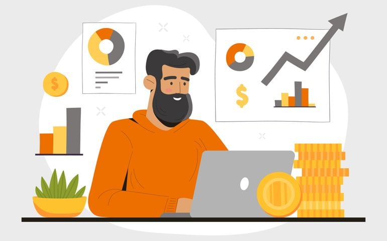 Financial analyst at home. Man sits at laptop, evaluates graphs and charts.