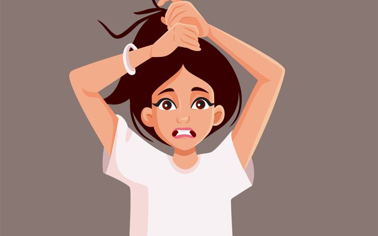 Stressed girl with messy hairdo having a bad hair day