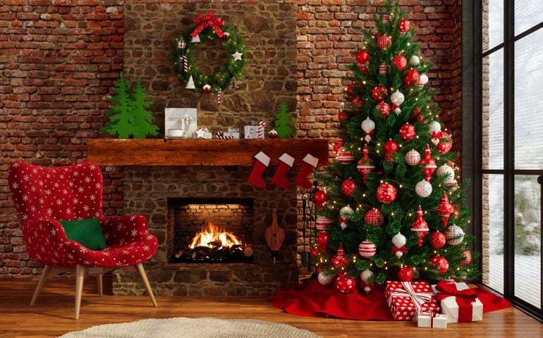 Chalet With Christmas Decoration. Living Room Interior With Christmas Tree, Ornaments, Gift Boxes, Armchair And Fireplace