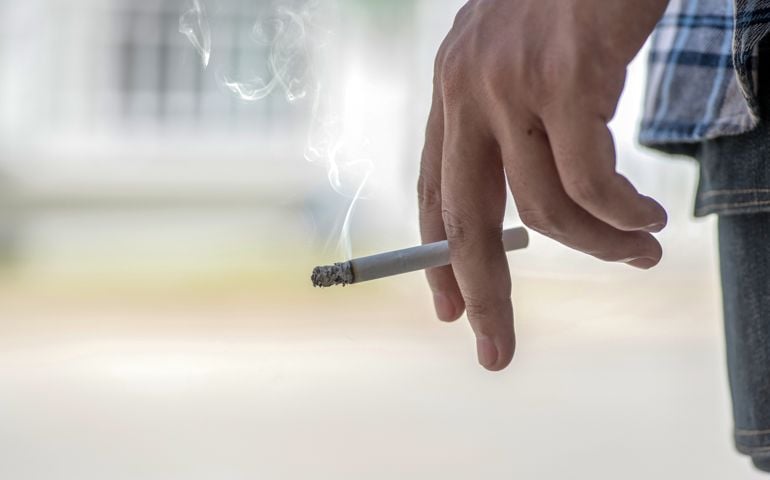man smoking a cigarette