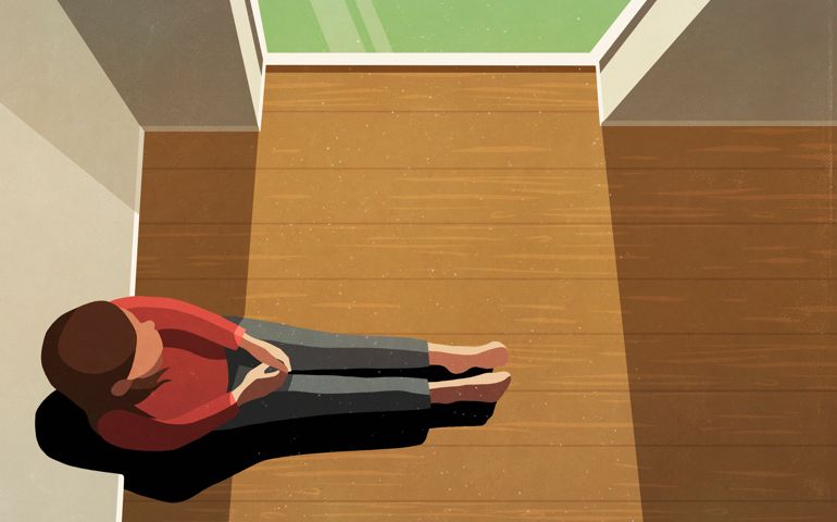 Lonely woman sitting in sunny window
