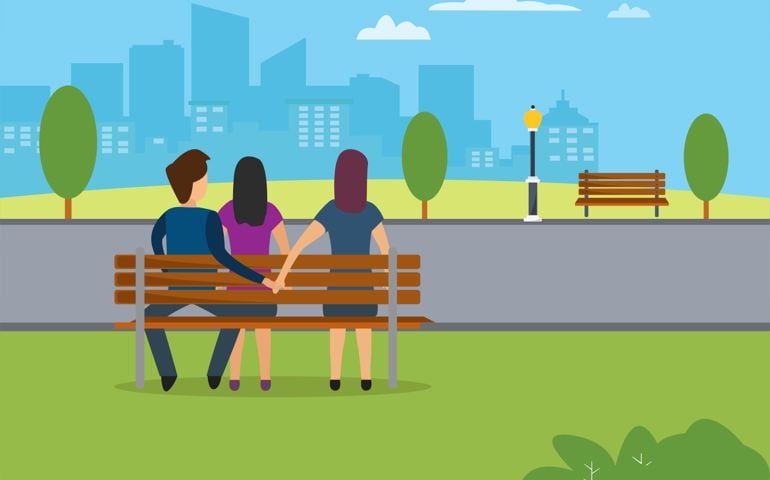 Man having an affair with his friend, sitting on the bench while hugging his girlfriend and holding hands with his friend at the back