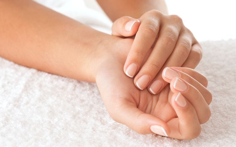 Beautiful hands on the white towel