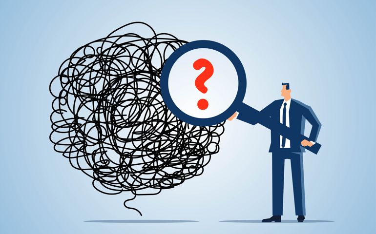 Problem finding and solving, trouble and solution, looking for the cause of emotional stress and upset mood, businessman holding magnifying glass to find question mark