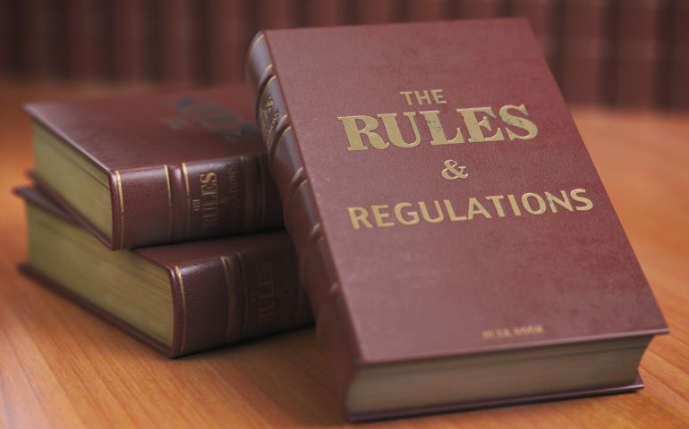 Rules an regulations books with official instructions and directions of organization or team