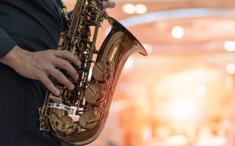 International jazz day and World Jazz festival. Saxophone, music instrument played by saxophonist player musician in fest.