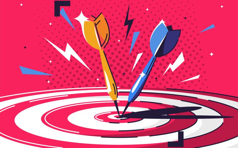Darts hitting a point on a target,
