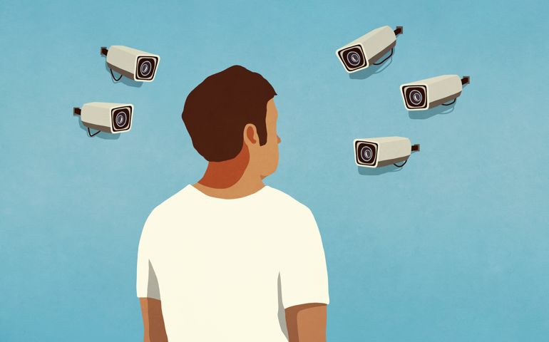 Surveillance cameras pointed at man