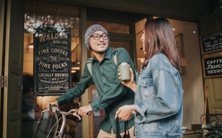 reusable, cup, cafe, coffee shop, couple, smiling, talking,