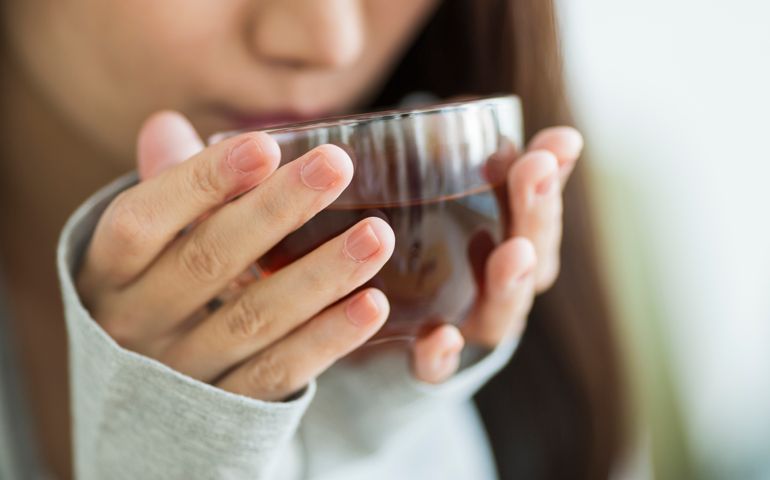 Young woman drinking tea