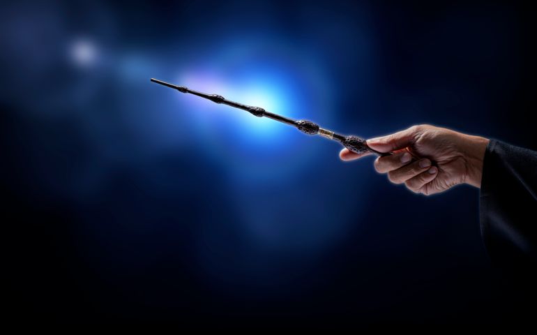 Magic wand with sparkle on blue background, Miracle magical stick Wizard tool on hot blue.