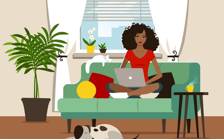 Young woman using a laptop at home.