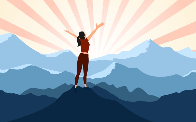 successful woman hiker enjoy the view with arms open on cliff edge top of mountain and sunshine background.